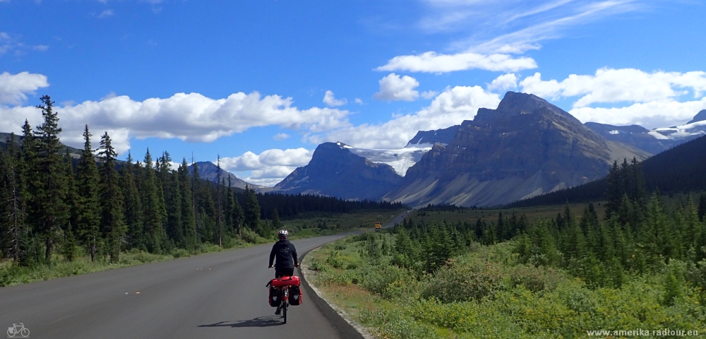 Cycling from Columbia Icefield via Saskatchewan River Crossing to Lake Louise.  Icefields Parkway by bicycle.